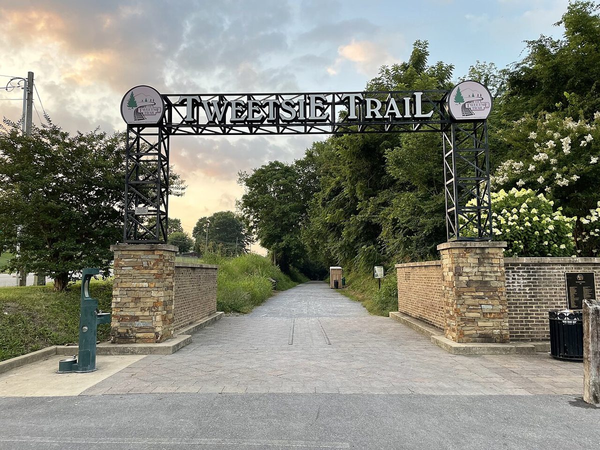 The start of the Tweetsie Trail in Johnson City, where a pair of narrow gauge rails is embedded in the pavement.
